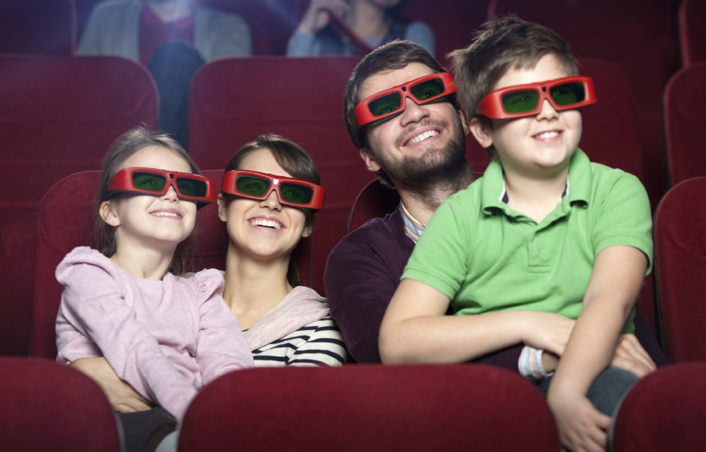 Smiling family in the movie theater