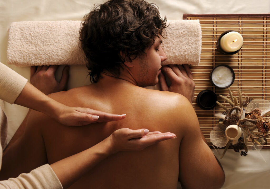 young guy in a beauty salon getting massage