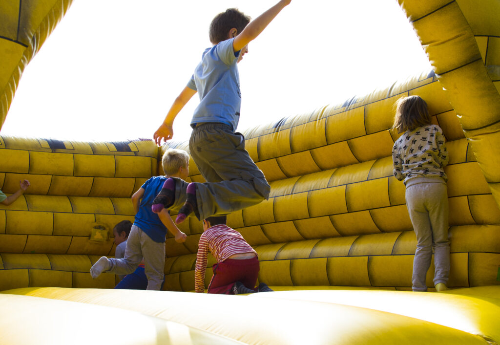 Kids jumping on castle
